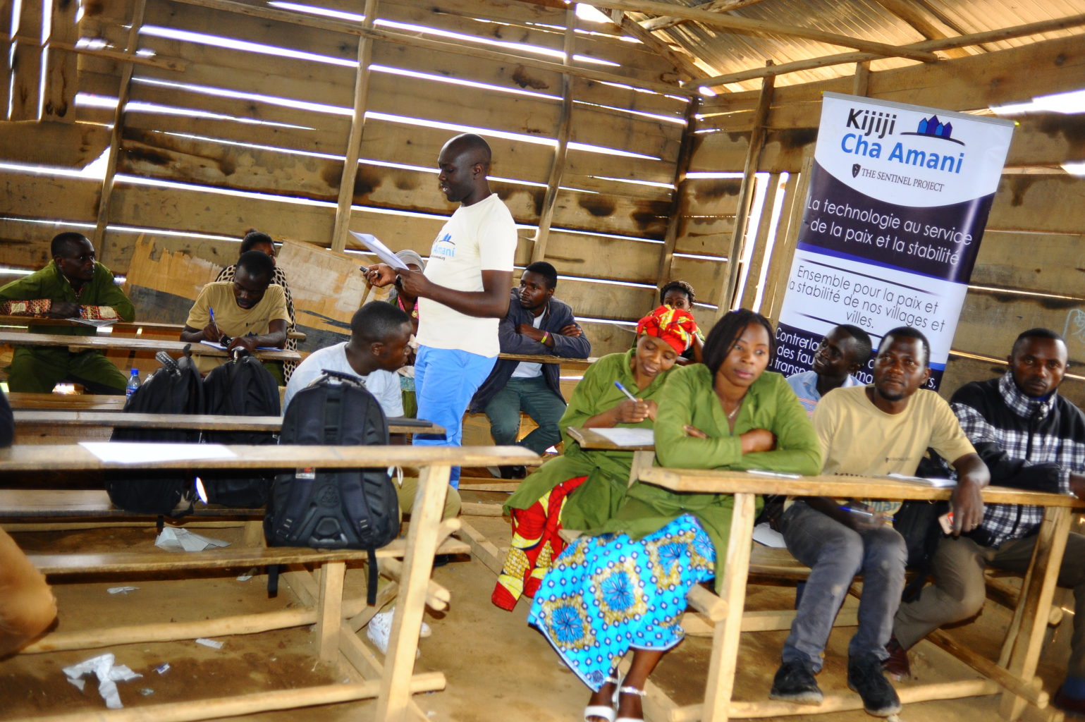 Several people sitting at desks in a room.